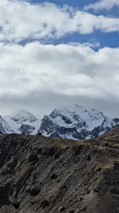 Snow-covered ridge of Om Parvat seen from the approach trail